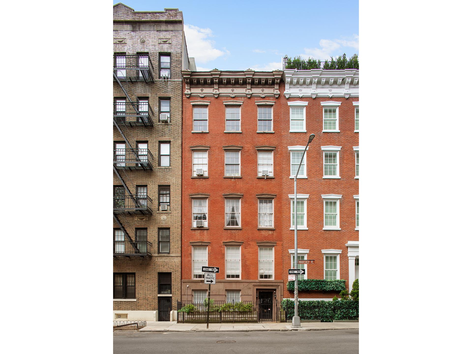 Red-brick townhouse on Waverly Place with ornate cornice and iron-fenced stoop.