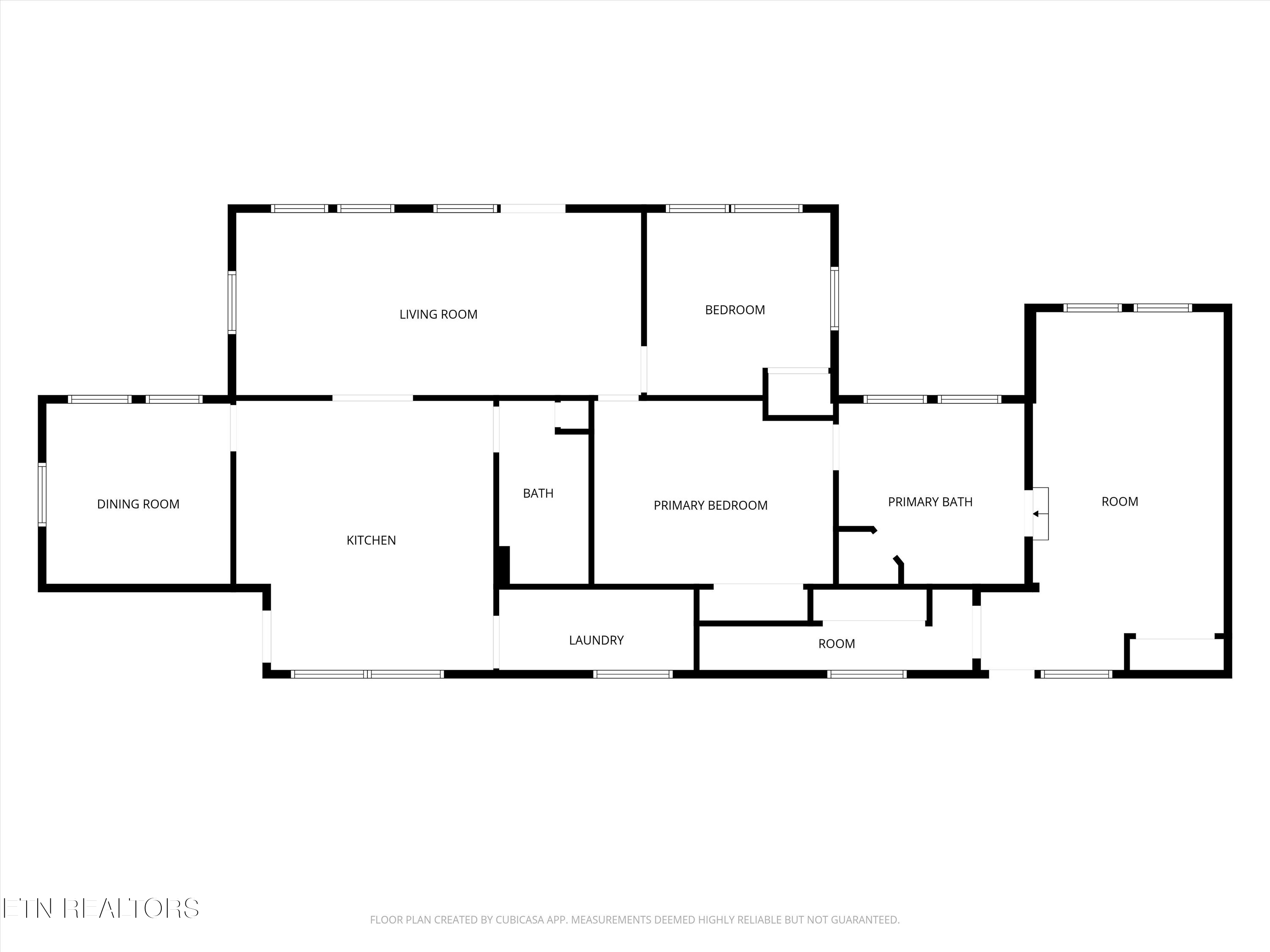 Floor plan with living, dining, kitchen, three bedrooms, two baths, laundry, and two rooms.