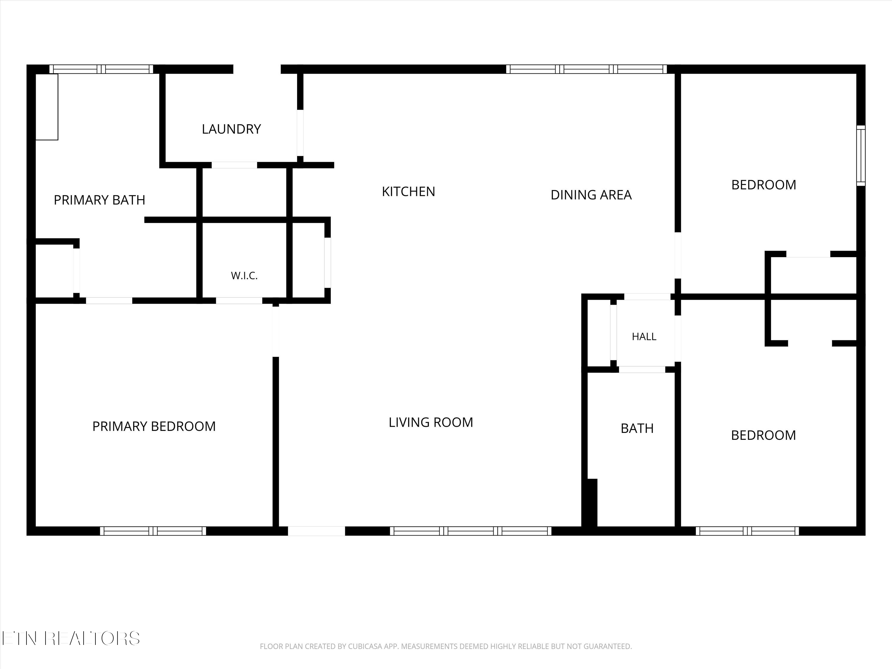 Floor plan showing three bedrooms, two bathrooms, a kitchen, dining area, living room, and laundry.