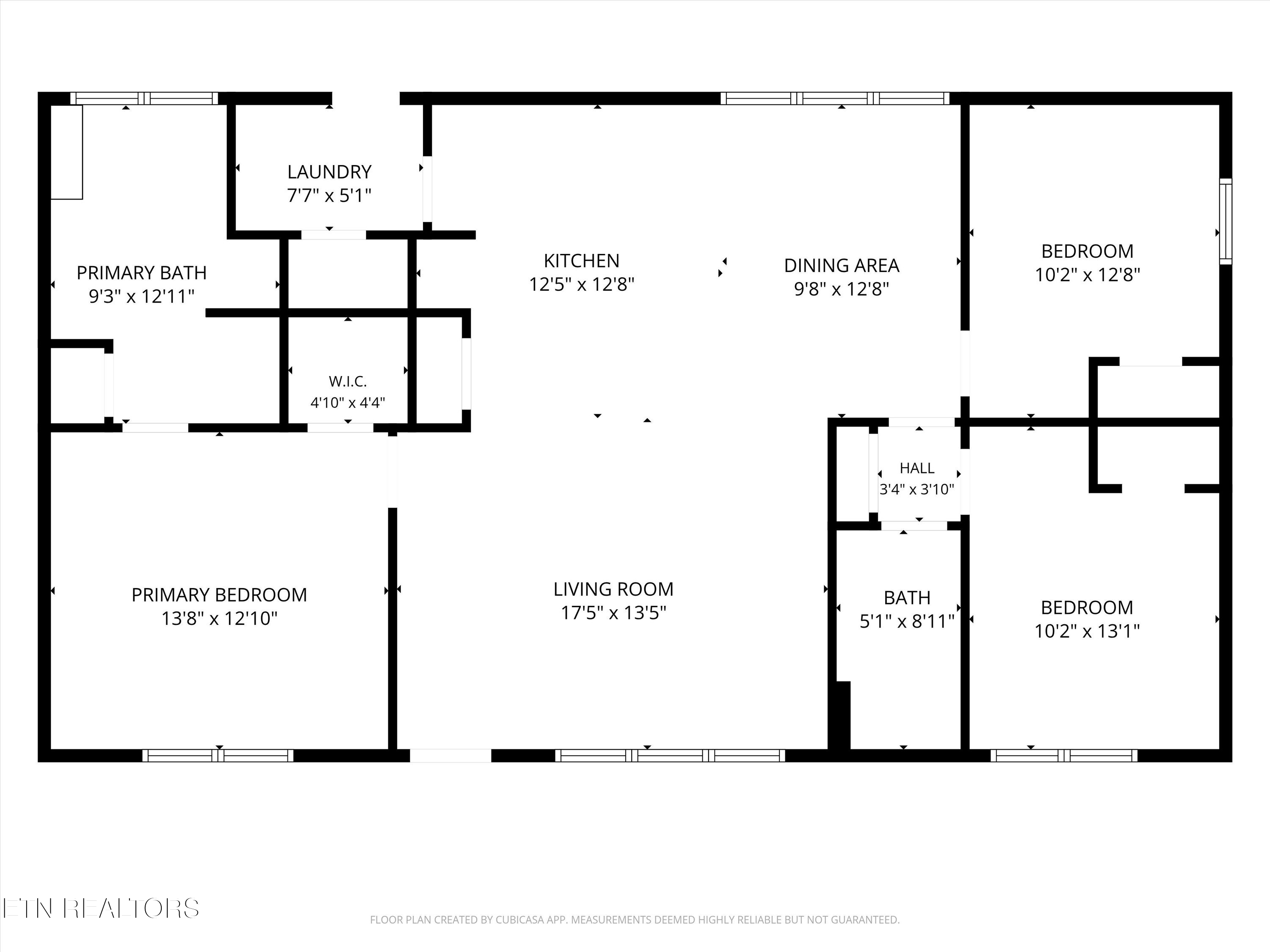 Floor plan showing three bedrooms, two baths, a kitchen, dining area, and living room.