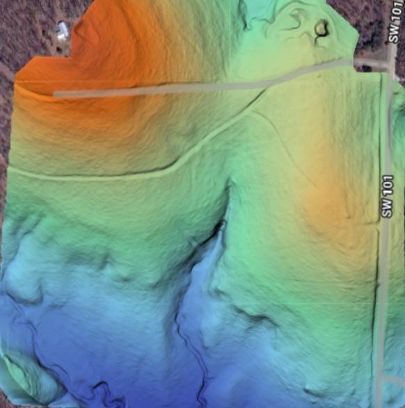 Terrain relief map of an outlined parcel beside SW 101 and SW 100.