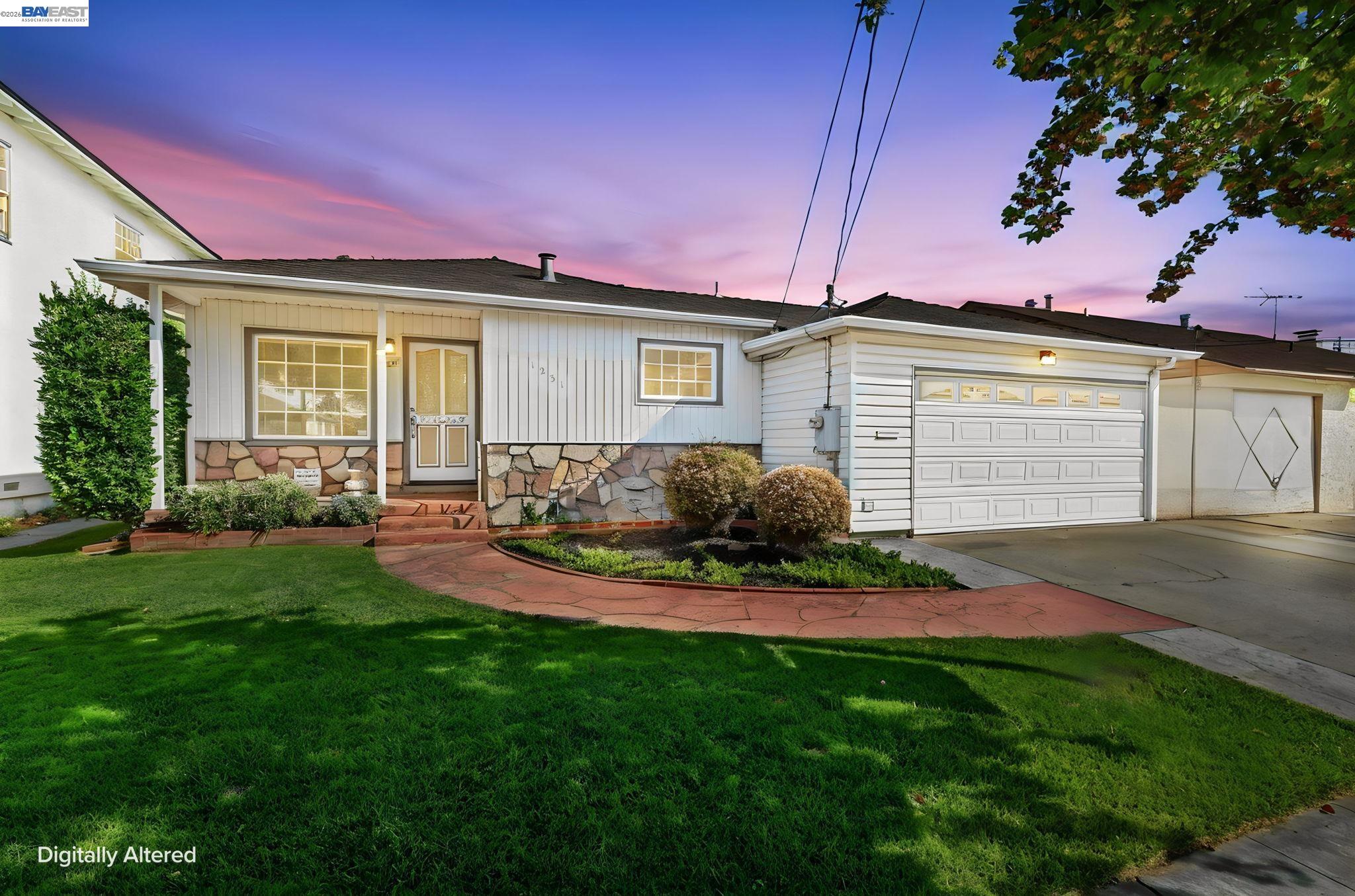 Single-story home with stone facade, attached garage, and landscaped front lawn at dusk.