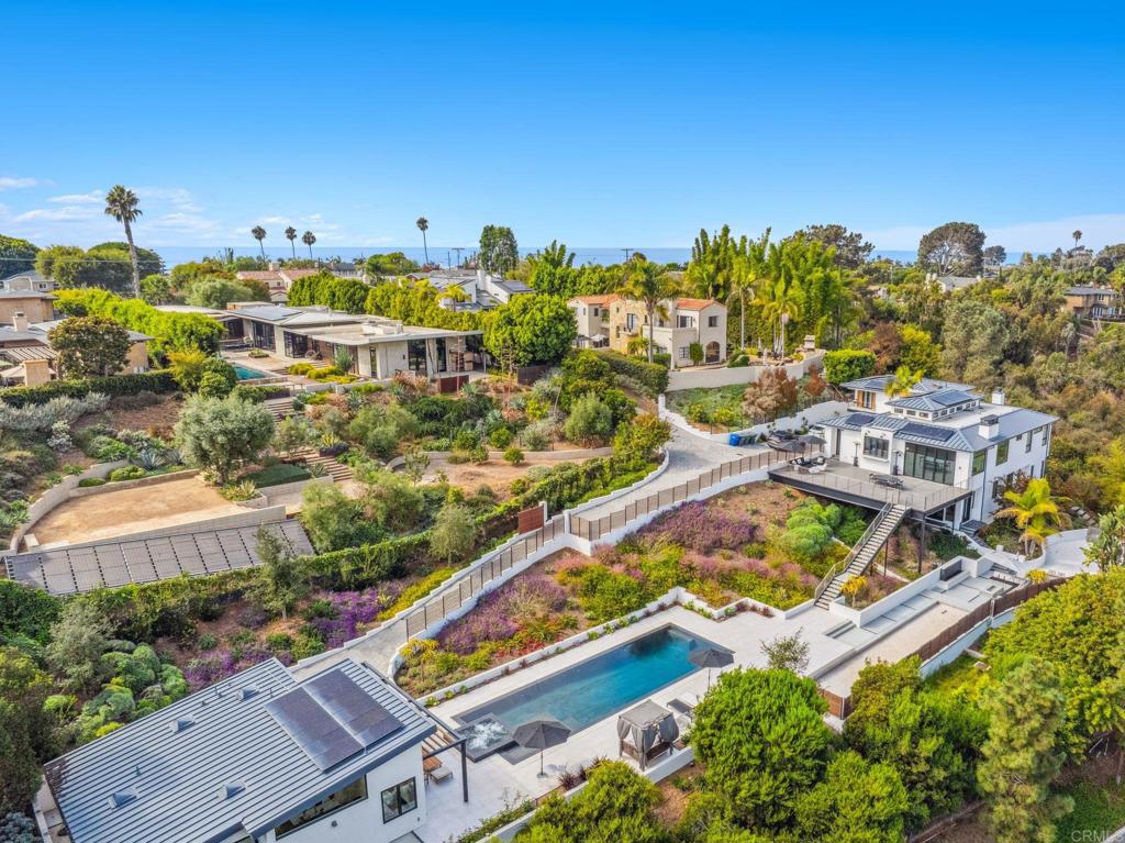 Aerial view of luxury hillside homes and landscaped estate