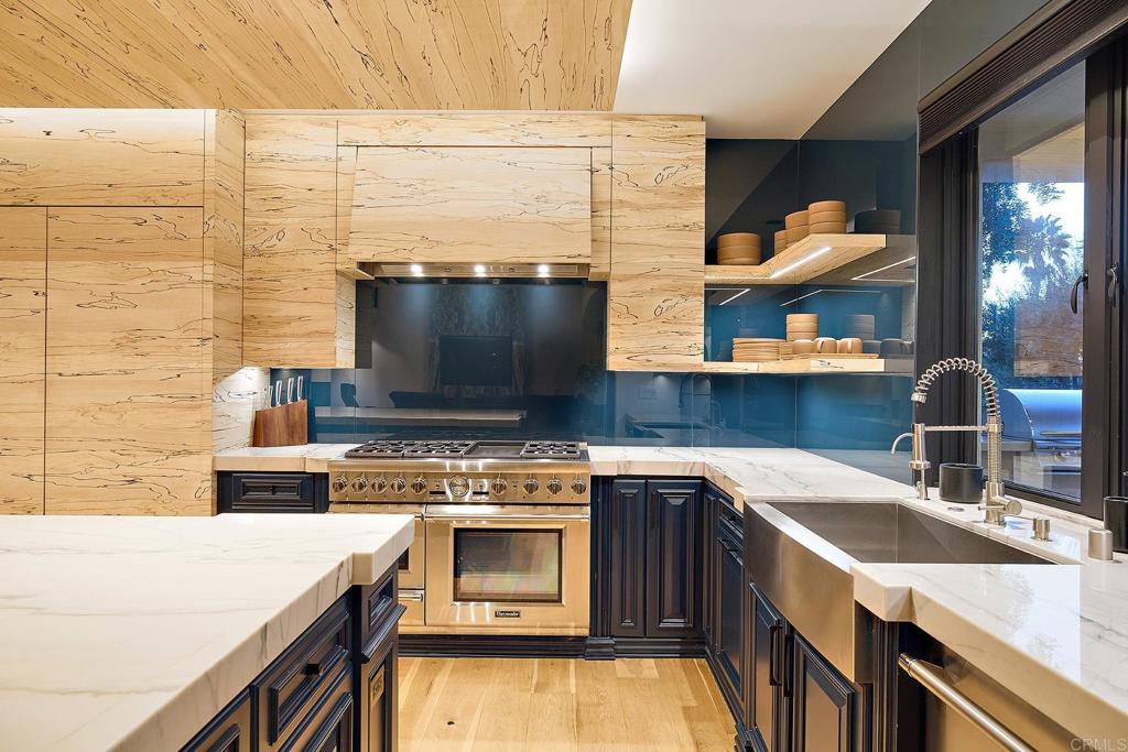 Modern Scandinavian-style kitchen with wood accents and open shelving