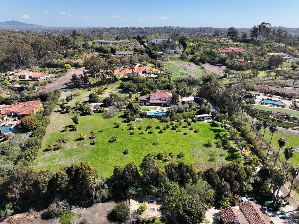Aerial drone view of large landscaped estate grounds