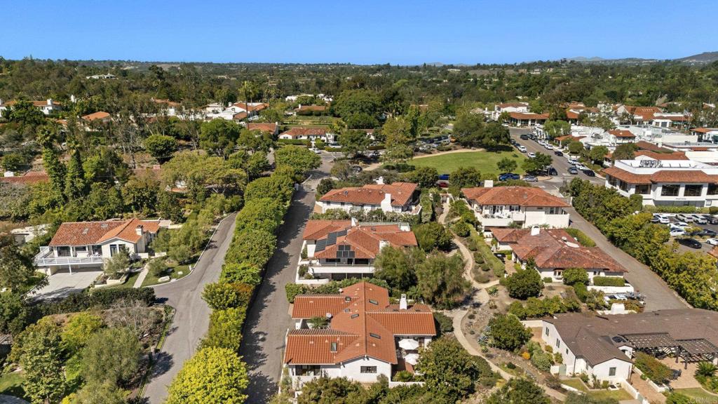 Neighborhood aerial view showing homes and tree-lined streets
