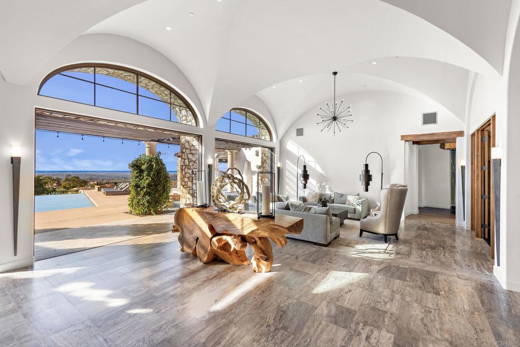 Bright luxury living room with high ceilings and view windows