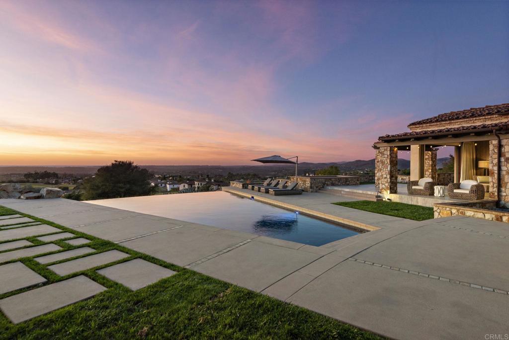 Modern patio and pool area with sunset views