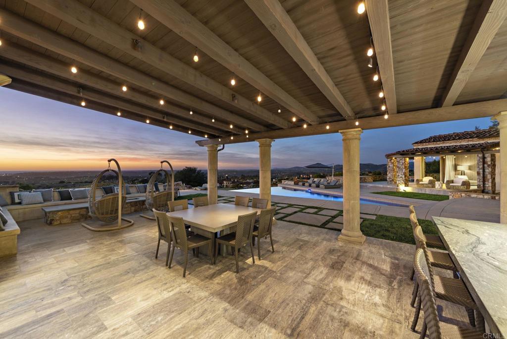 Twilight outdoor dining terrace with panoramic views