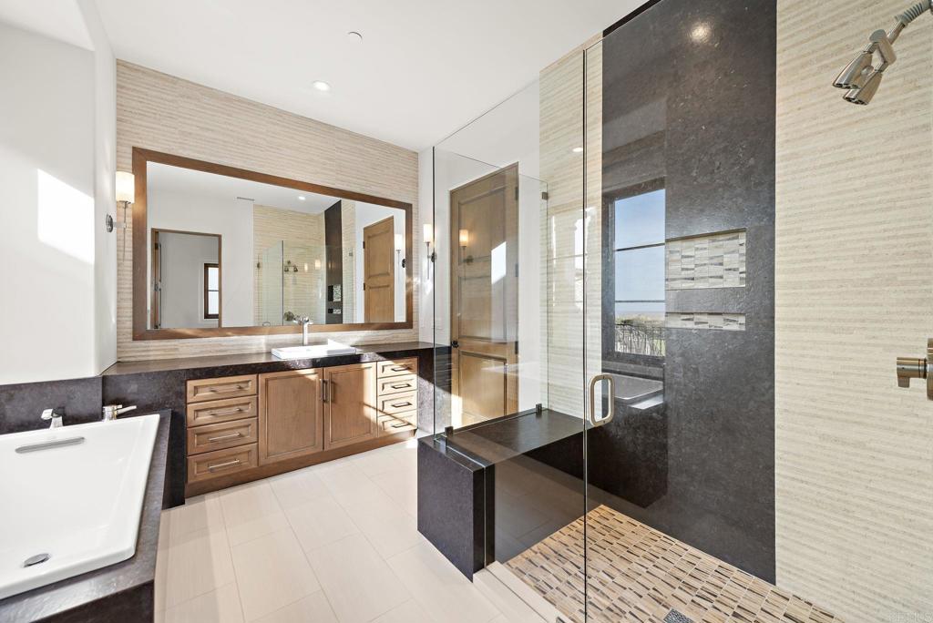 Spa-style bathroom with oversized shower and soaking tub