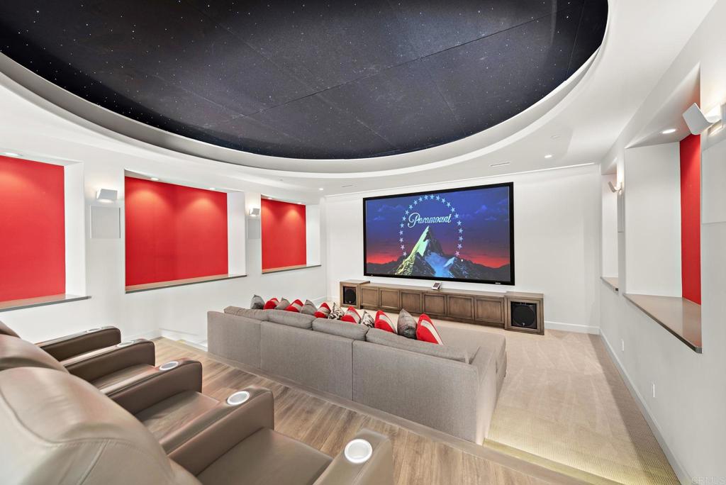 Private home theater with stadium seating and LED ceiling