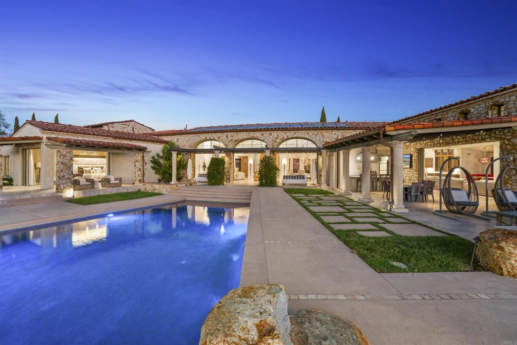 Resort-style pool and backyard of luxury Santaluz residence