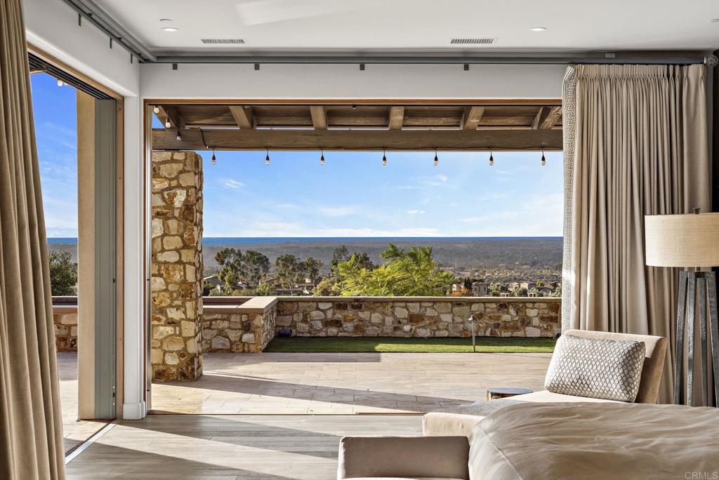 Spa-style bathroom with freestanding tub and mountain views