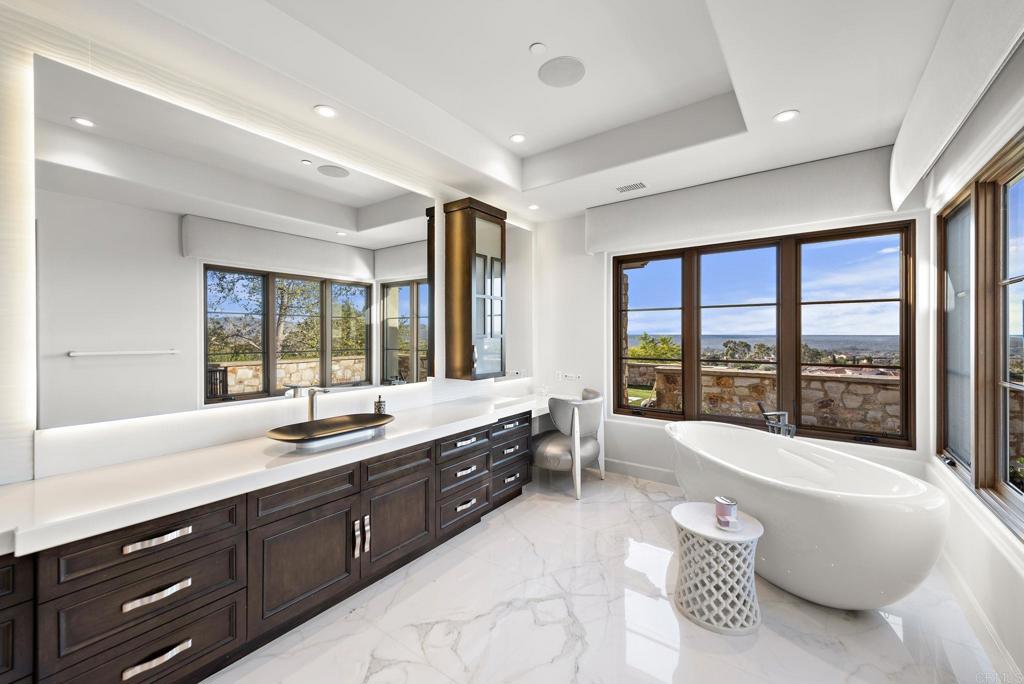 Bathroom with tub and views