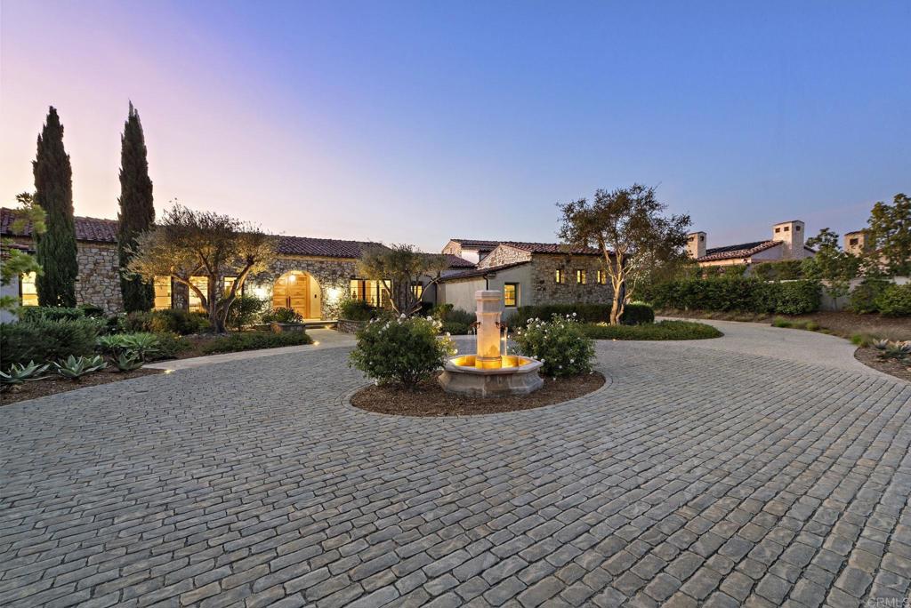 Stone-paved motor court and grand entrance driveway