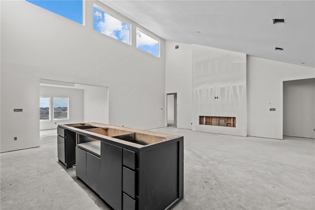 Open-concept great room in a new construction home in Kings Landing Corpus Christi built by Jade Homes