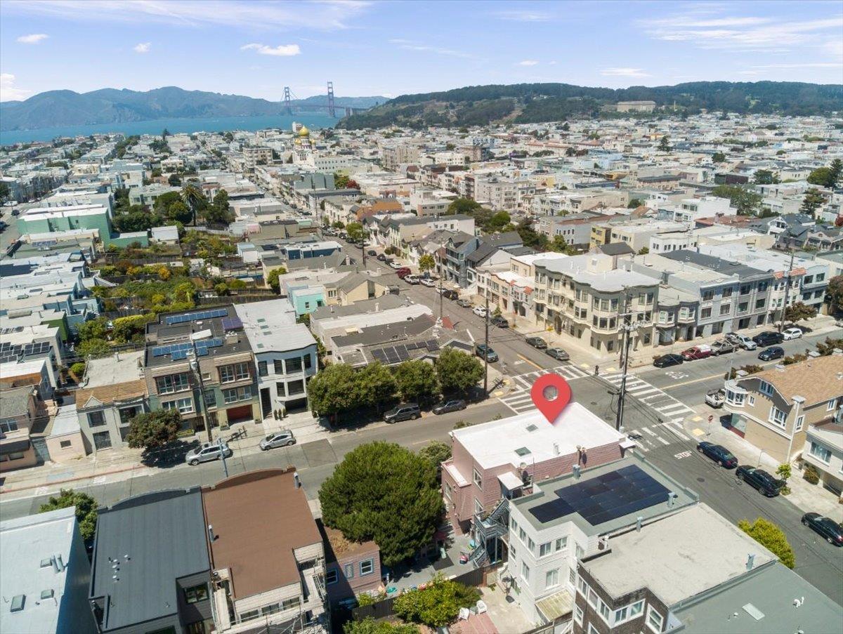 Aerial view of the 27th Avenue property, with San Francisco neighborhoods, the bay, and Golden Gate Bridge beyond.