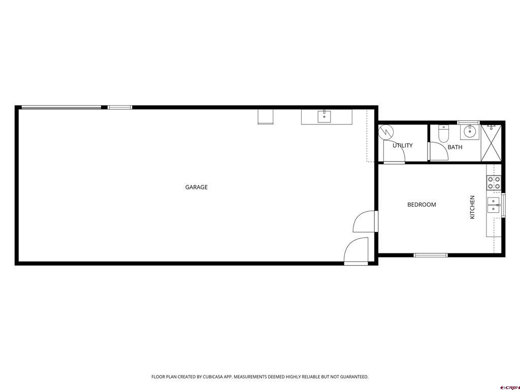 Floor plan with a large garage and an adjoining bedroom, kitchen, bathroom, and utility room.