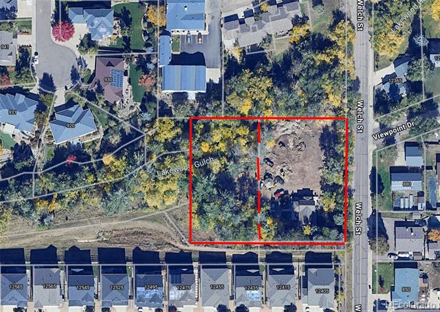 Aerial view of a red-outlined cleared parcel beside Welch Street and Lakewood Gulch.