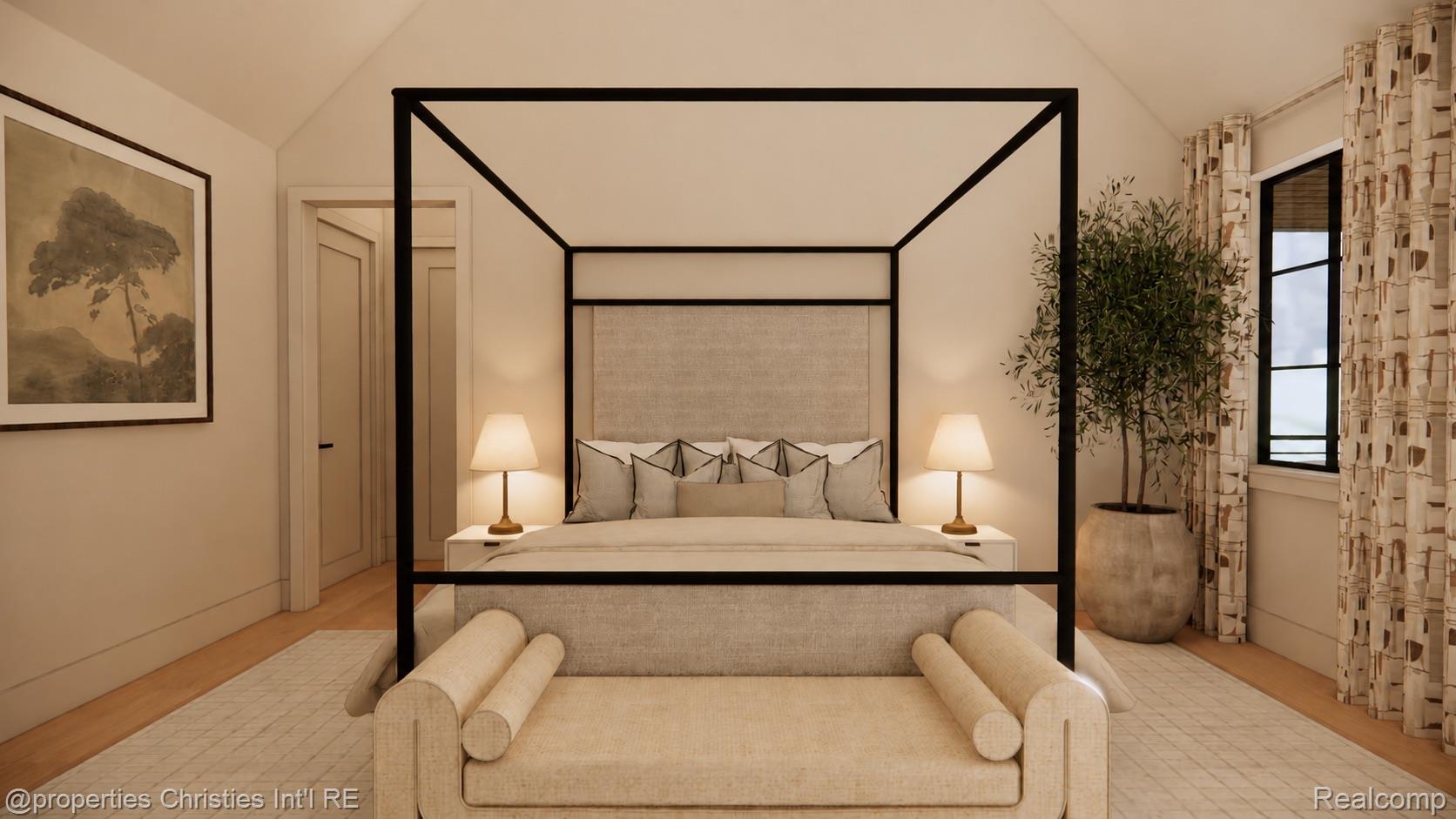Bedroom with a black four-poster bed, upholstered bench, matching lamps, and a potted tree beside the window.