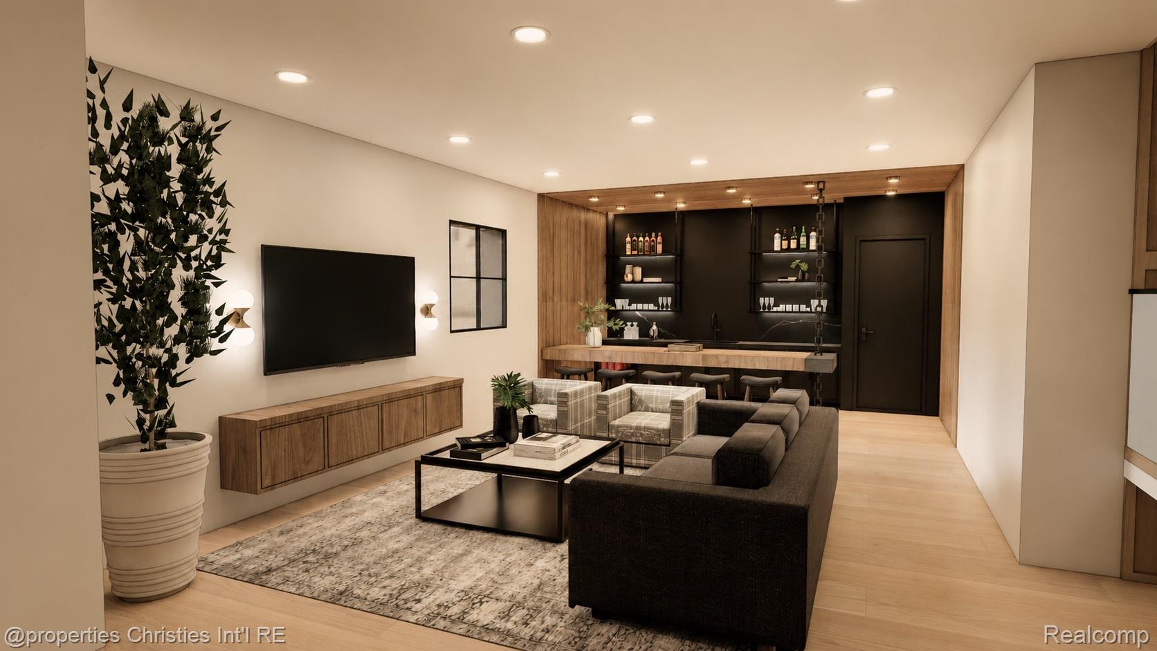 Modern living room with a dark sectional, plaid chairs, and a built-in bar.