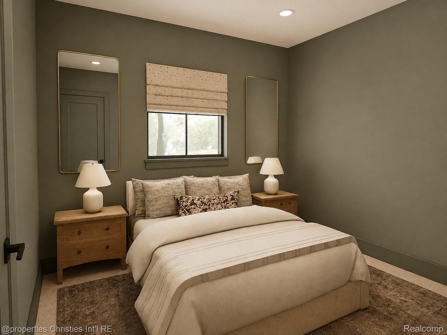 Bedroom with a cream bed, wooden nightstands, matching lamps, and olive-gray walls.