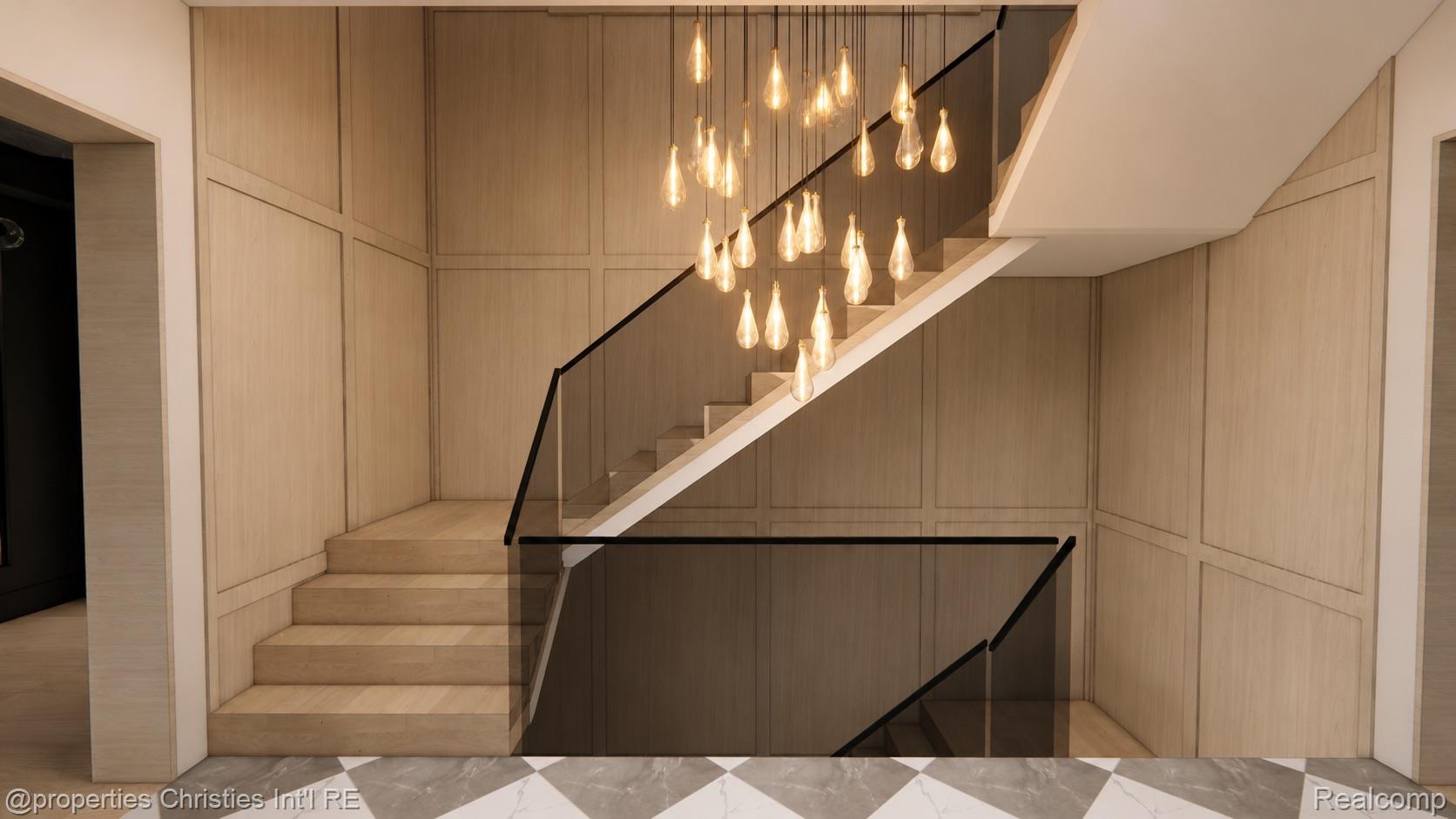 Modern staircase with wood-paneled walls, glass railings, pendant lights, and a marble floor.