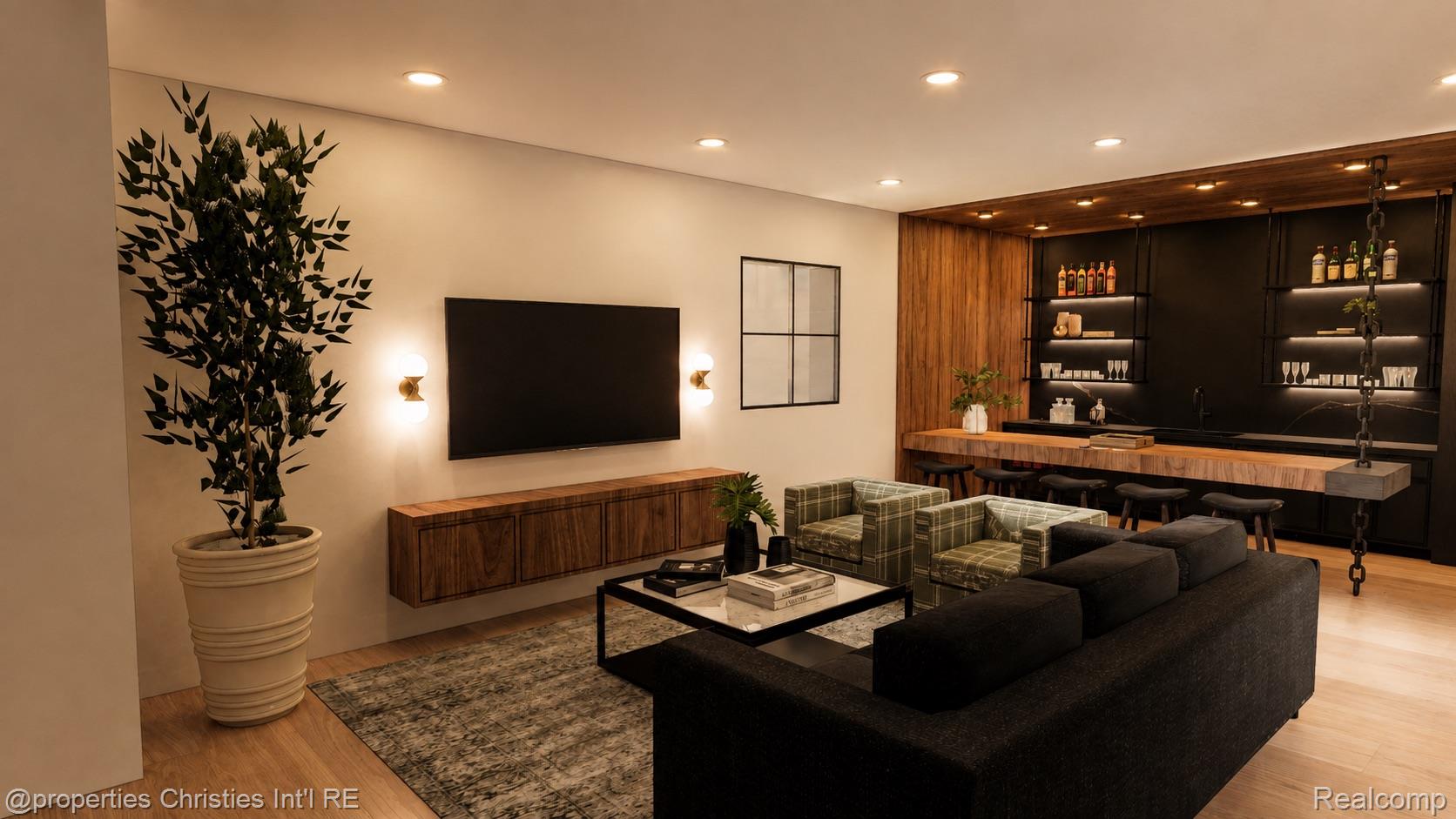 Modern living room with a dark sectional, plaid armchairs, and a wood-and-black wet bar.