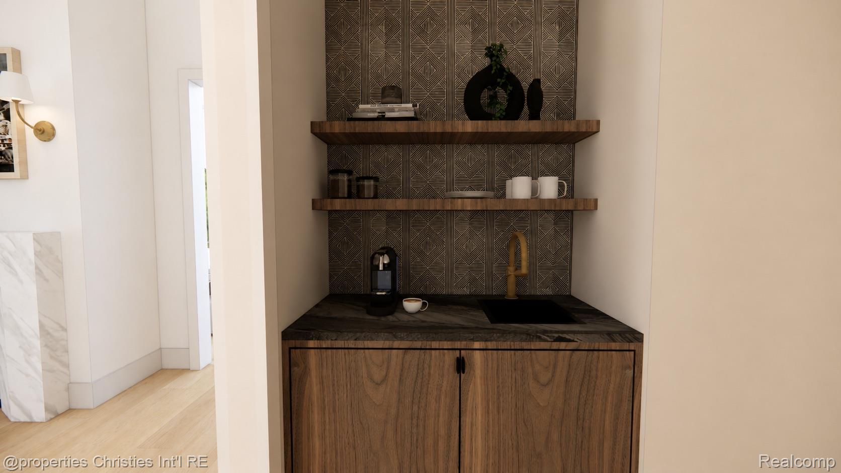 Built-in beverage station with a black sink, brass faucet, patterned tile, and floating wood shelves.