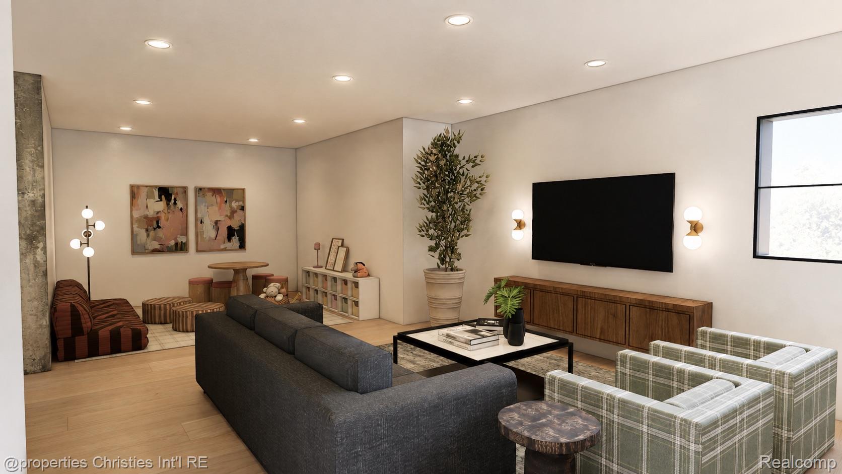 Living room with a dark sectional, plaid armchairs, wall-mounted television, and dining nook.