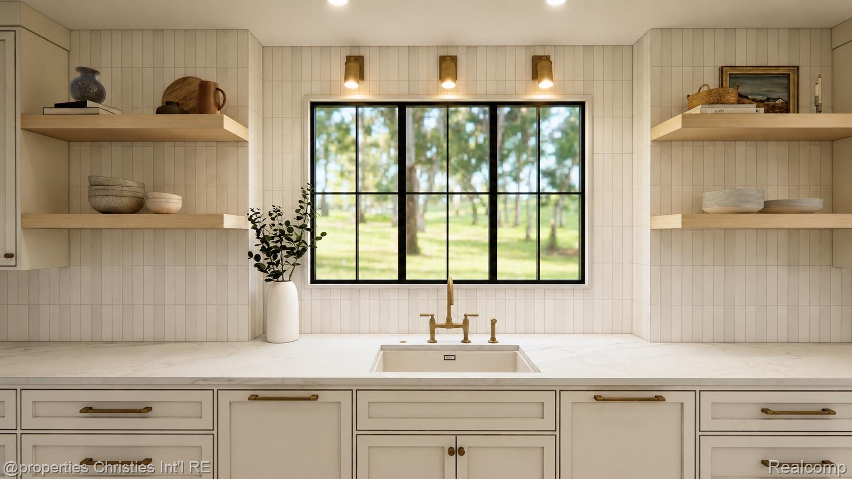 Kitchen with a farmhouse sink beneath a large black-framed window overlooking a leafy yard.