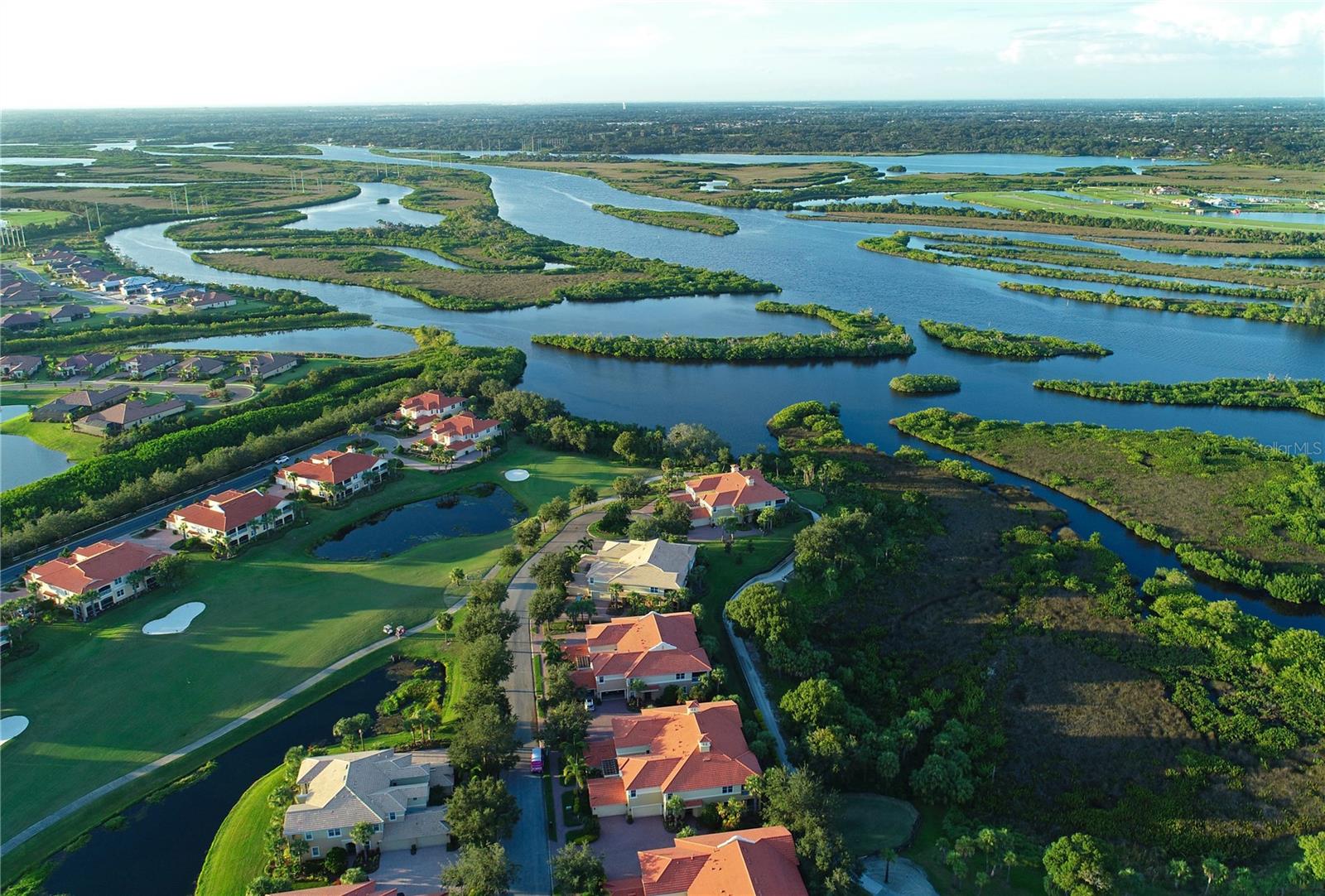 Aerial view of homes beside winding waterways and wetlands in Parrish.