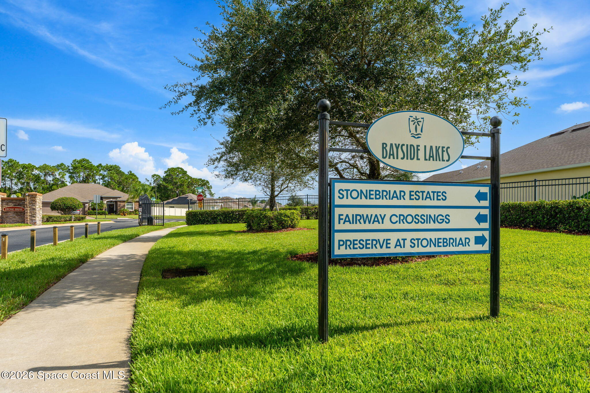 Bayside Lakes entrance sign with directions to Stonebriar Estates, Fairway Crossings, and Preserve at Stonebriar.