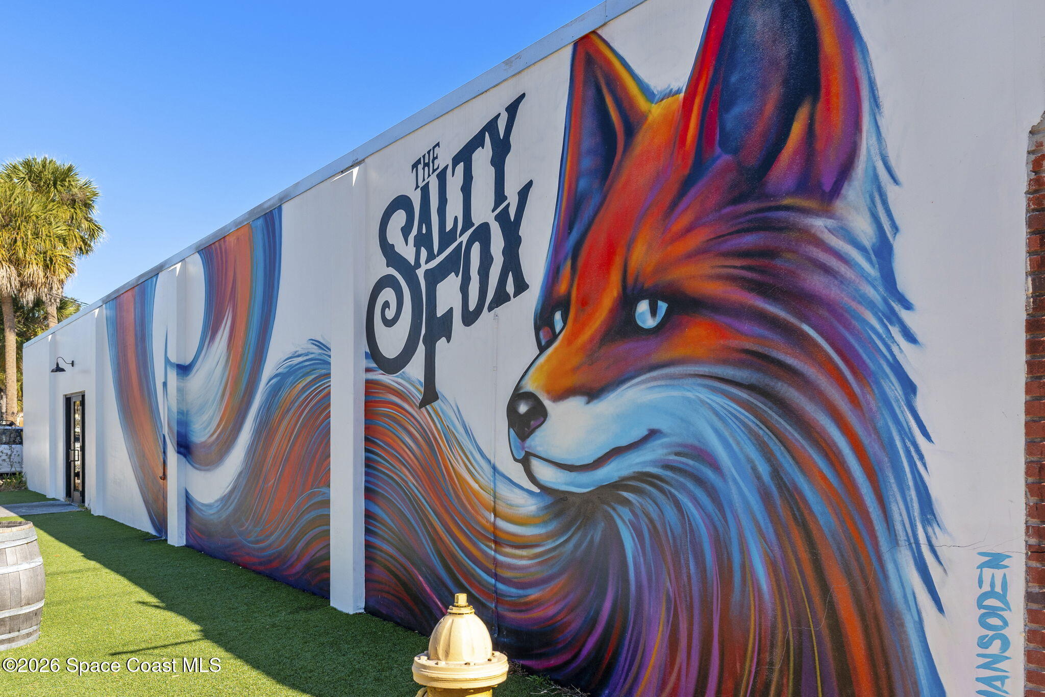 White building with a vivid fox mural and “THE SALTY FOX” lettering.