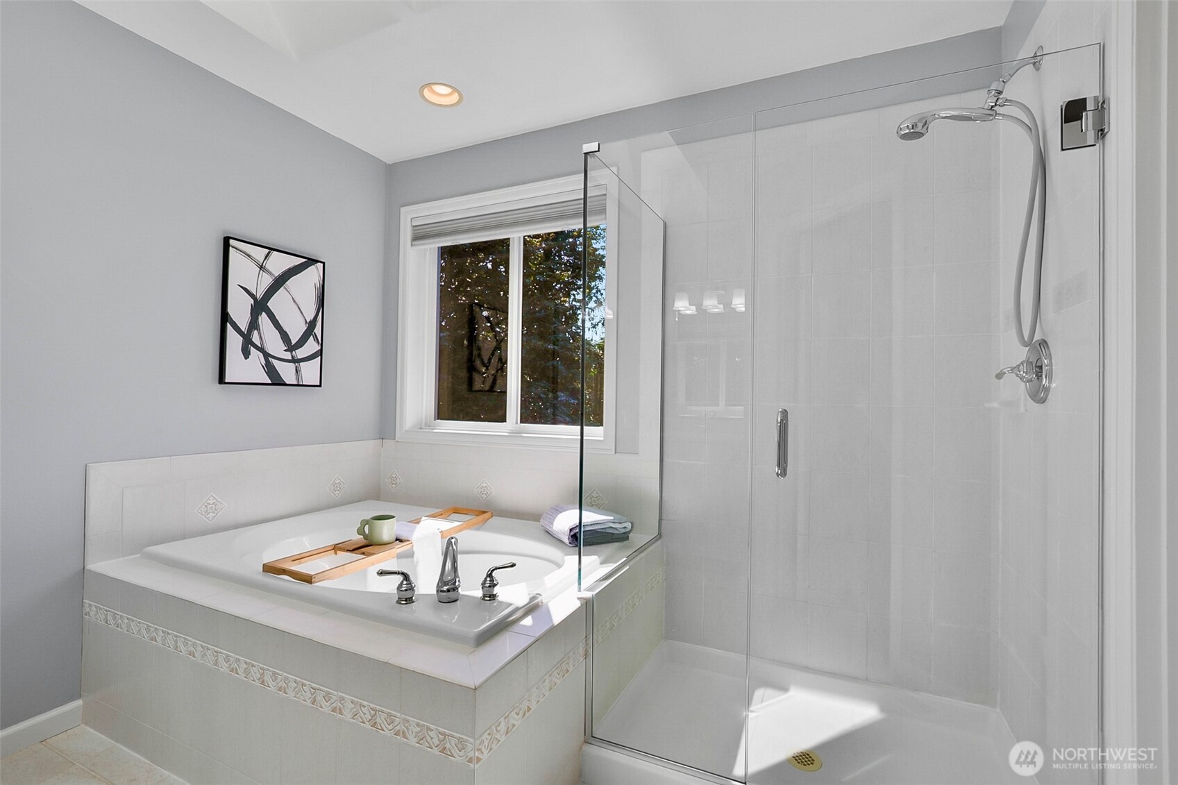 Bathroom with a tiled soaking tub beside a glass-enclosed walk-in shower.