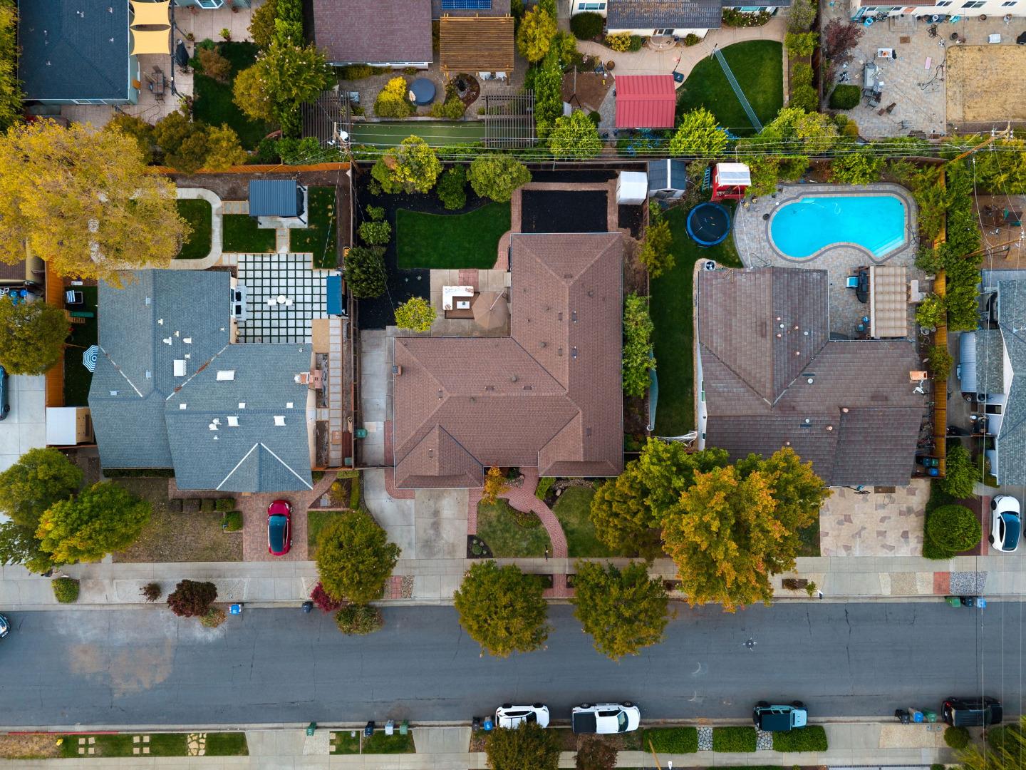Aerial view of 1281 Peralta Drive, showing the home, landscaped yard, and surrounding neighborhood.