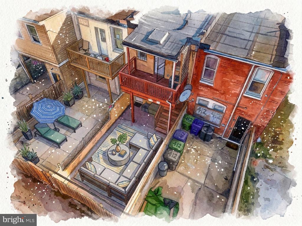 Aerial view of attached rowhouses with elevated decks, fenced patios, and furnished outdoor seating.