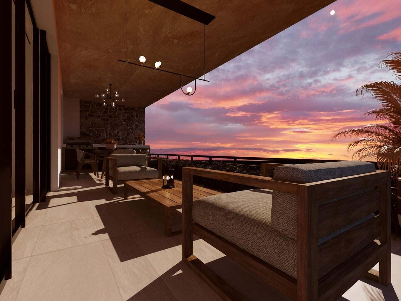 Penthouse terrace with wood lounge seating and an ocean sunset.
