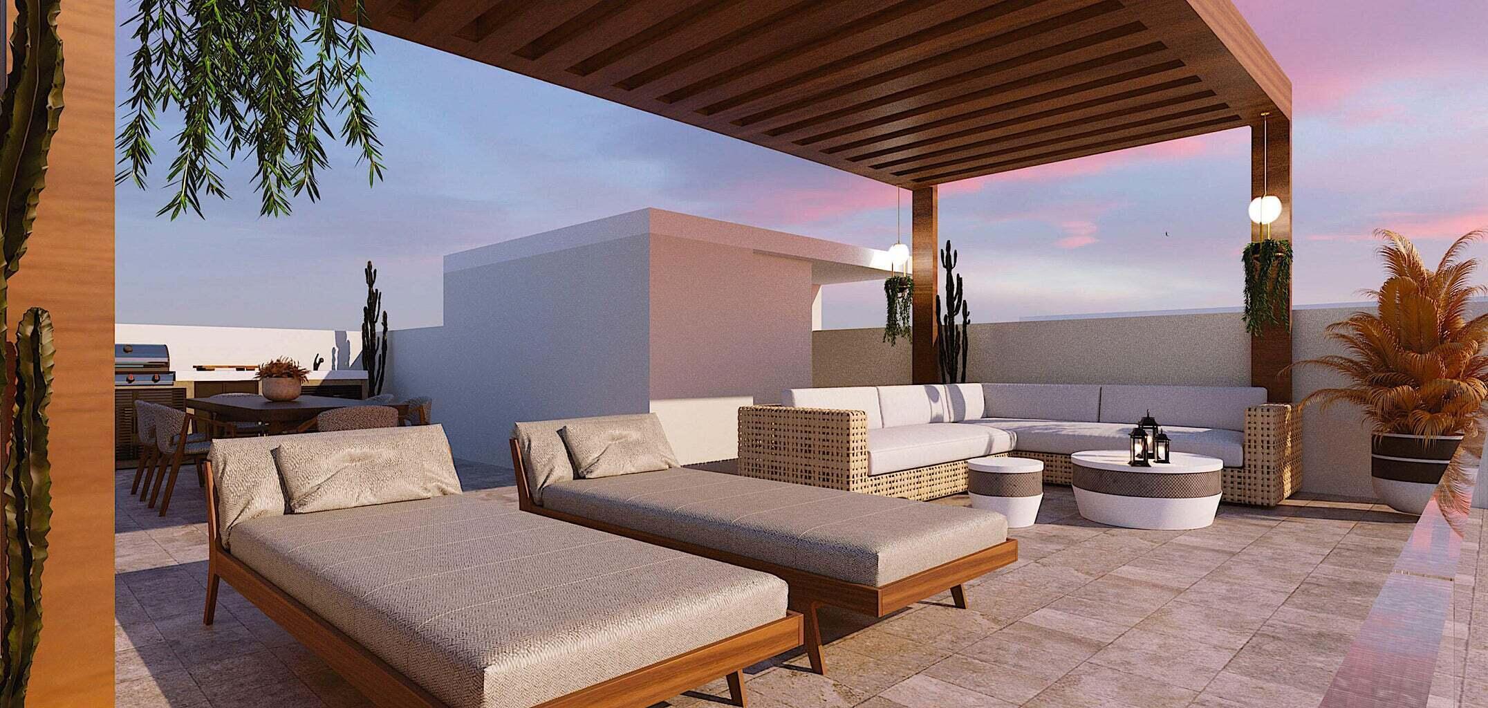 Penthouse rooftop terrace with pergola, cushioned seating, sun loungers, and sunset sky.