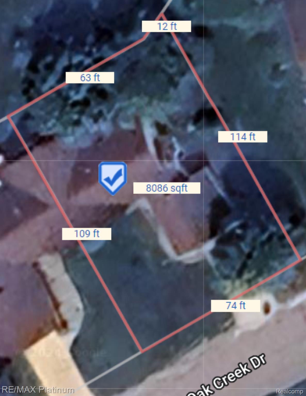 Aerial parcel map with red boundary lines, side measurements, and an area of 8,086 square feet.
