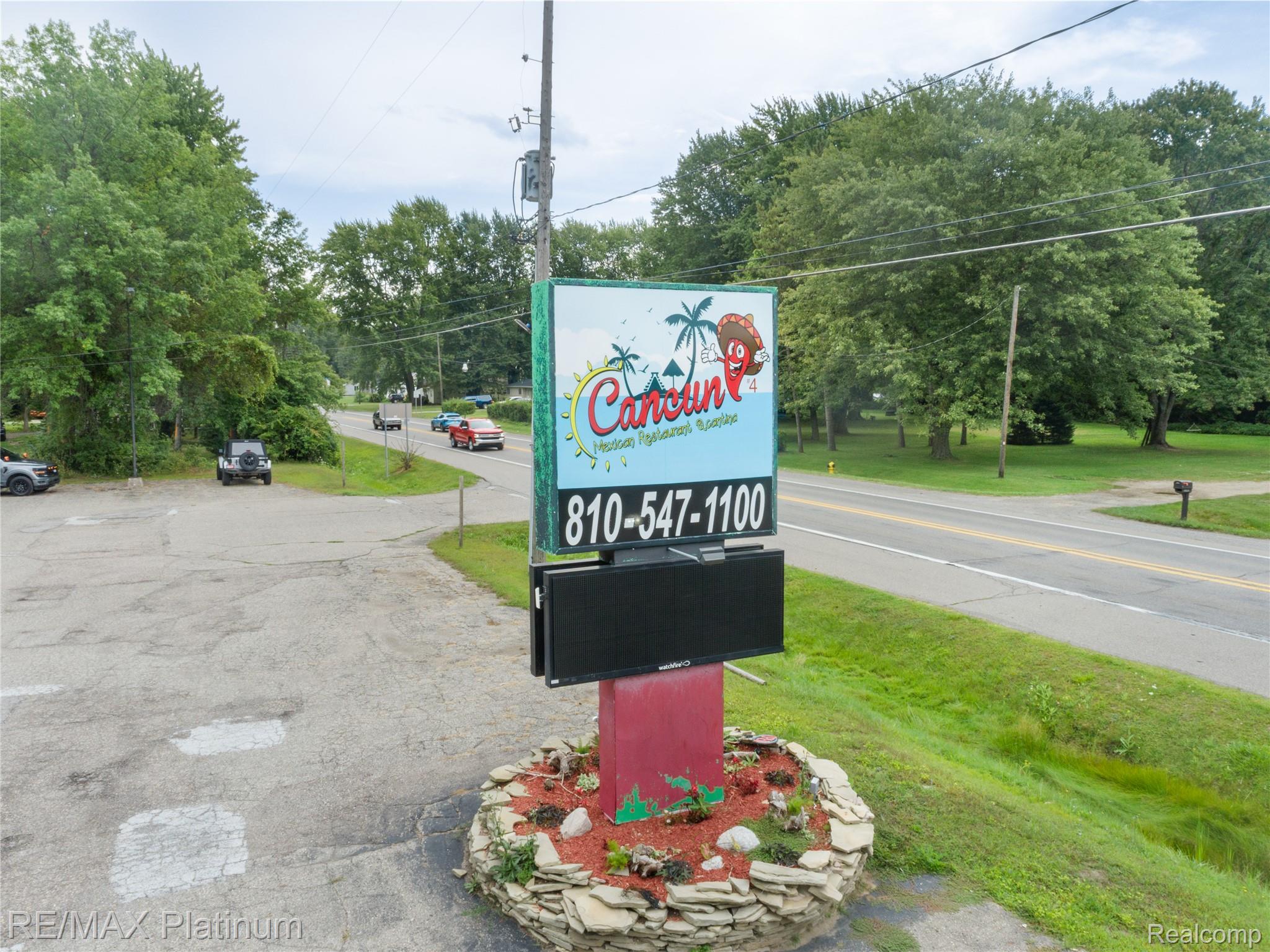 Roadside restaurant sign for Cancun Mexican Restaurant & Cantina, with the phone number 810-547-1100.