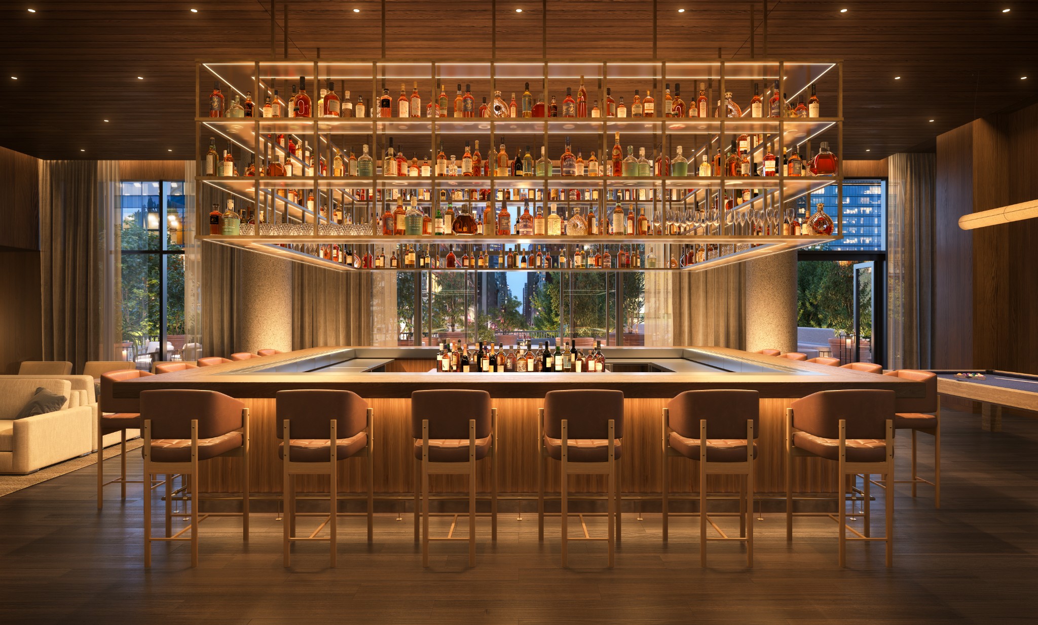 Bar lounge with a wood counter, leather stools, and illuminated shelves of bottles and glassware.
