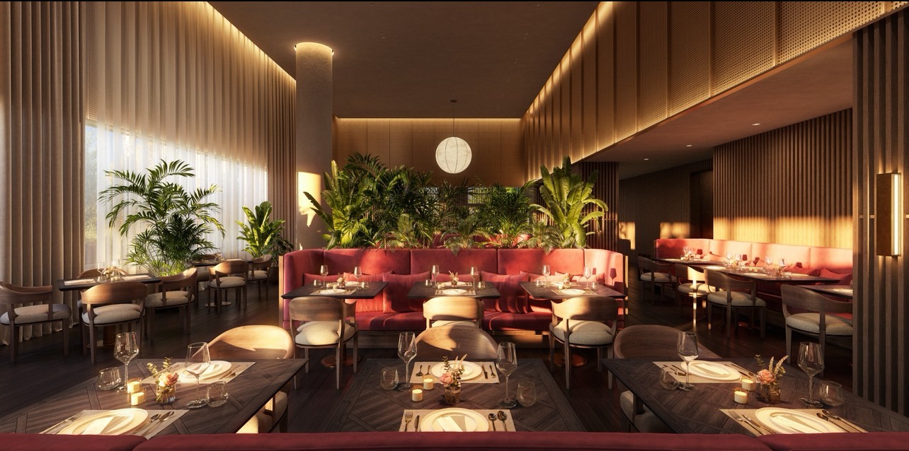 Dining room with red banquette seating, set tables, and indoor plants.