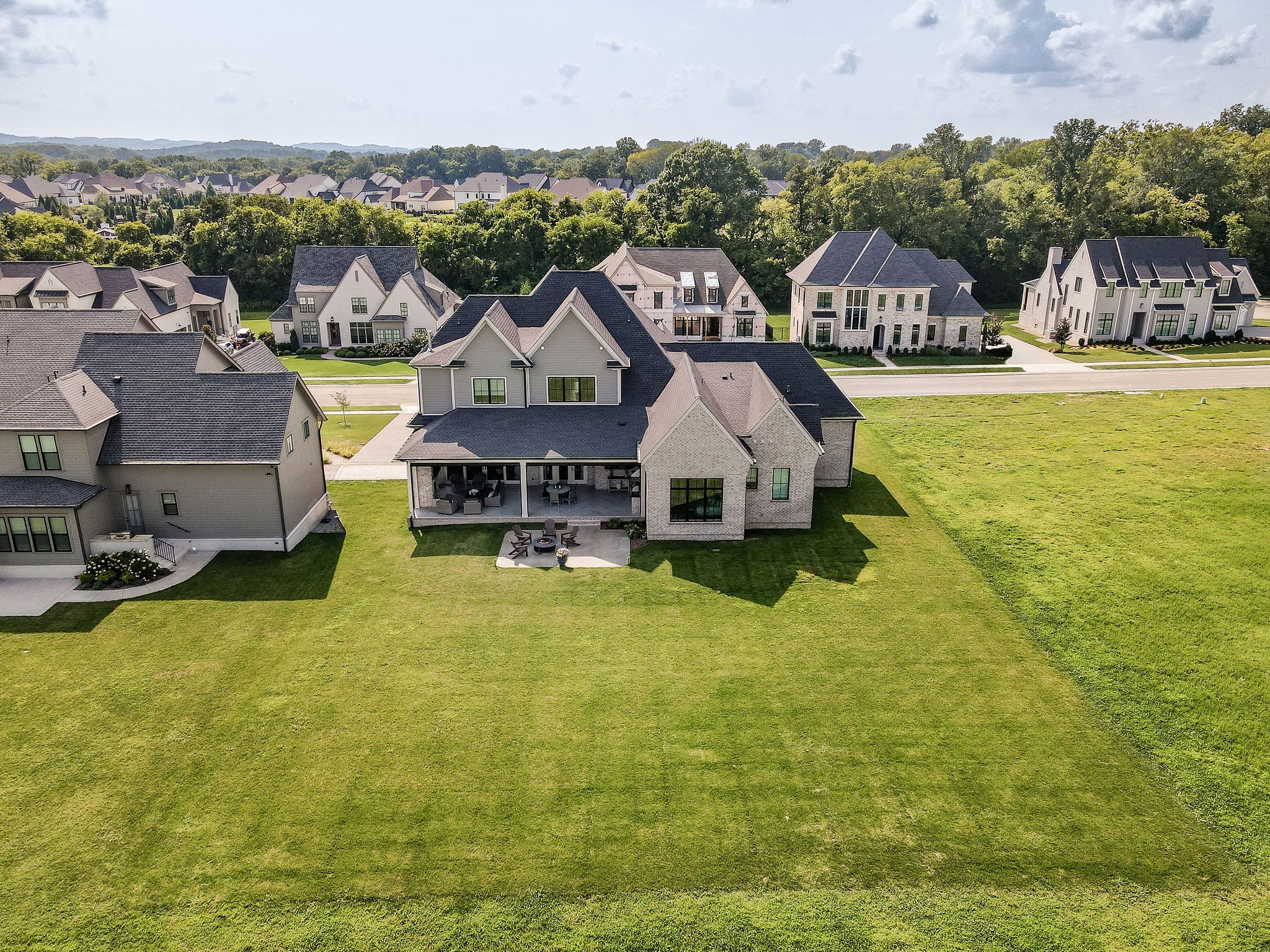 Aerial view of 6340 Percheron Lane showing its rear covered patio and broad lawn.