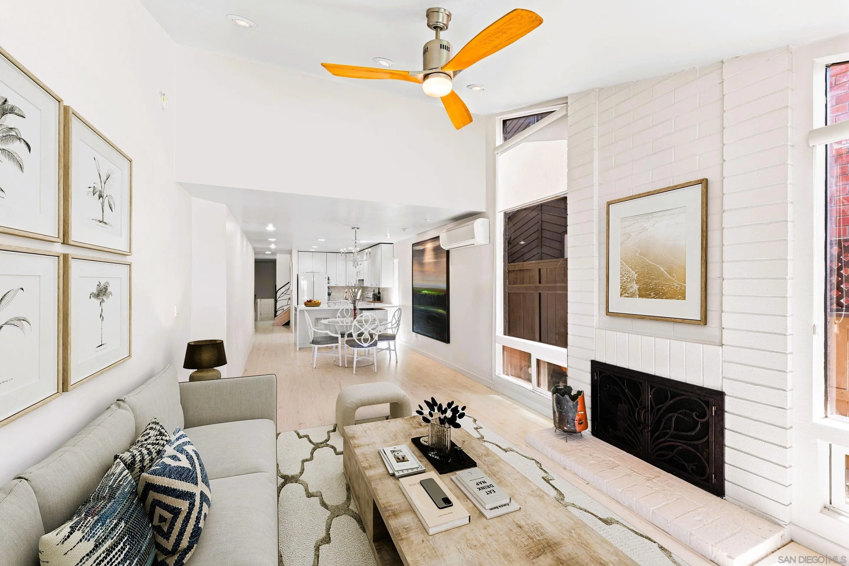 Spacious living room at 194 Neptune Ave-Encinitas-CA-92024-featuring high ceilings, remodeled kitchen, coastal design elements, and oceanfront ambiance in this luxury home listed by FW Property Group
