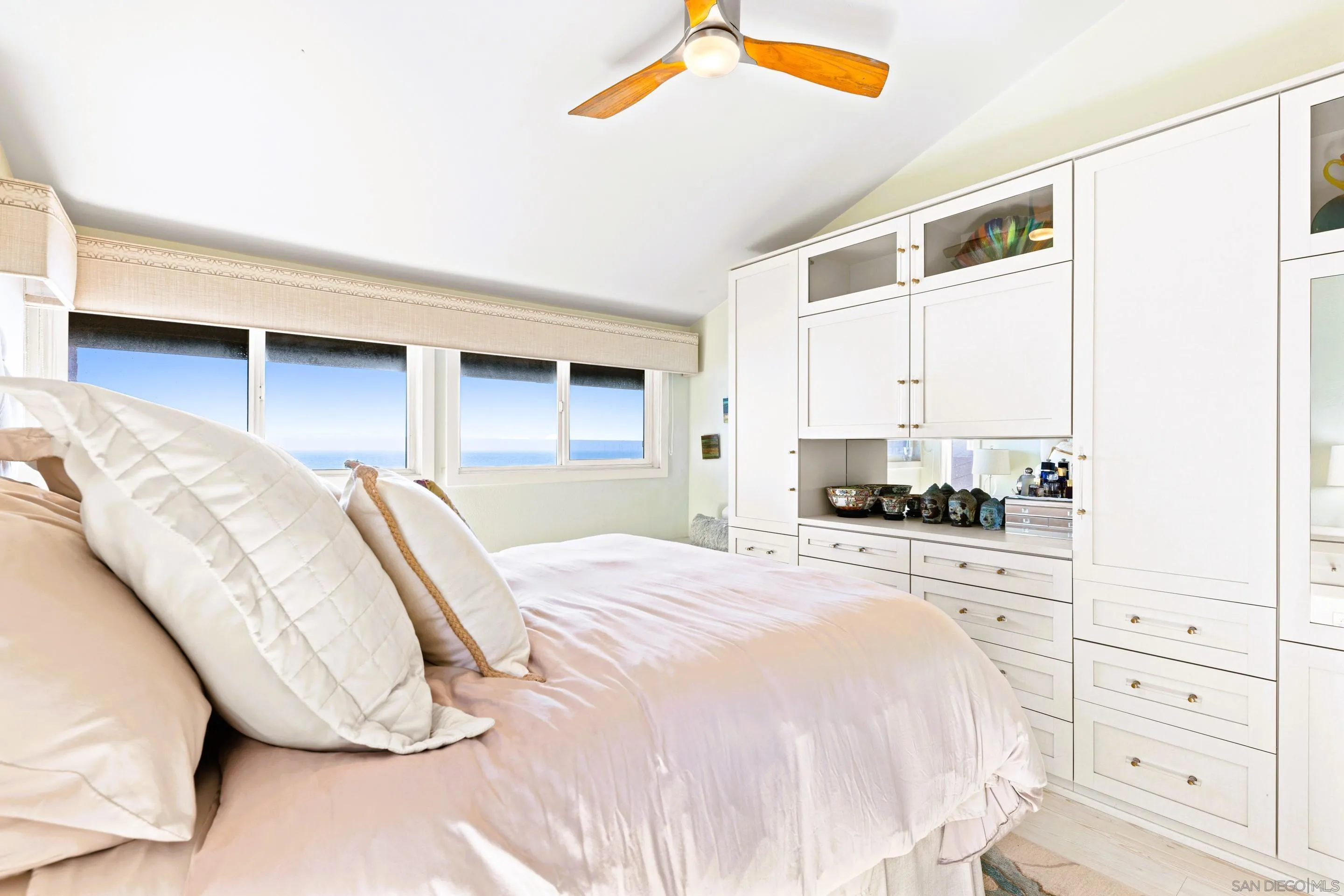 Primary bedroom at 194 Neptune Ave-Encinitas-CA-92024-Leucadia-featuring vaulted ceilings, custom cabinetry, ocean views, natural light, and upscale coastal design in this luxury home listed by FW Property Group