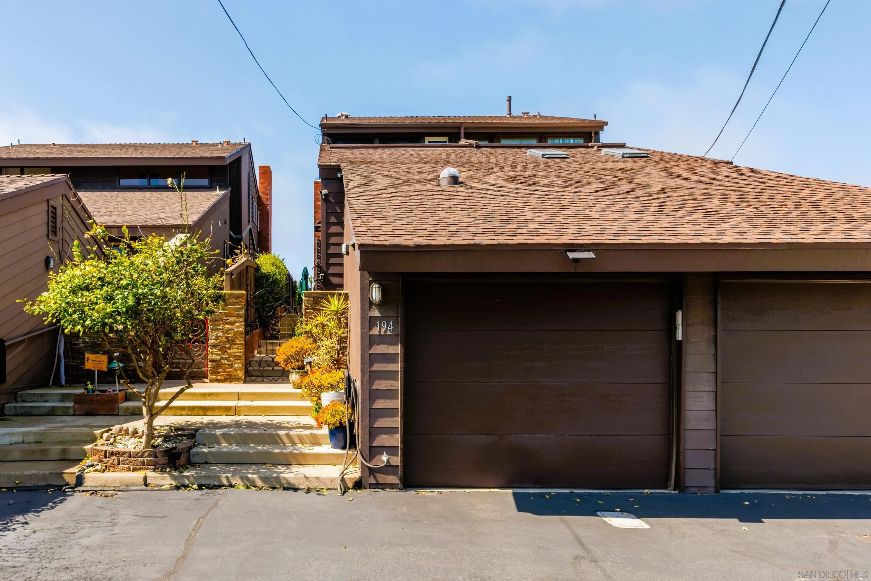 Private garage at 194 Neptune Ave-Encinitas-CA-92024-Leucadia-featuring secure parking, modern design, and direct access to this oceanview coastal property listed by FW Property Group