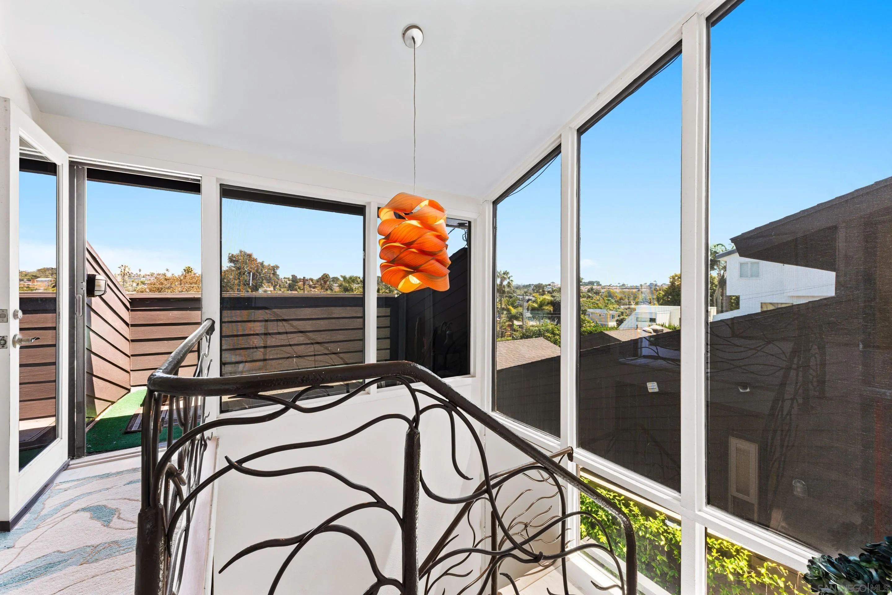Contemporary entryway at 194 Neptune Ave-Encinitas-CA-92024-Leucadia Neighborhood-featuring sculptural staircase, natural light, and artistic coastal design in this oceanfront home listed by FW Property Group