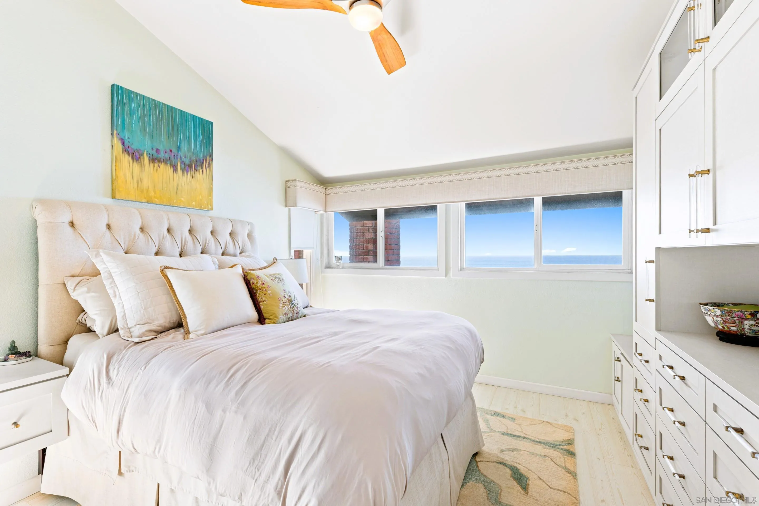 Primary bedroom at 194 Neptune Ave-Encinitas CA-92024 Leucadia featuring vaulted ceilings, ocean views, natural light, and upscale coastal design in this luxury home listed by FW Property Group