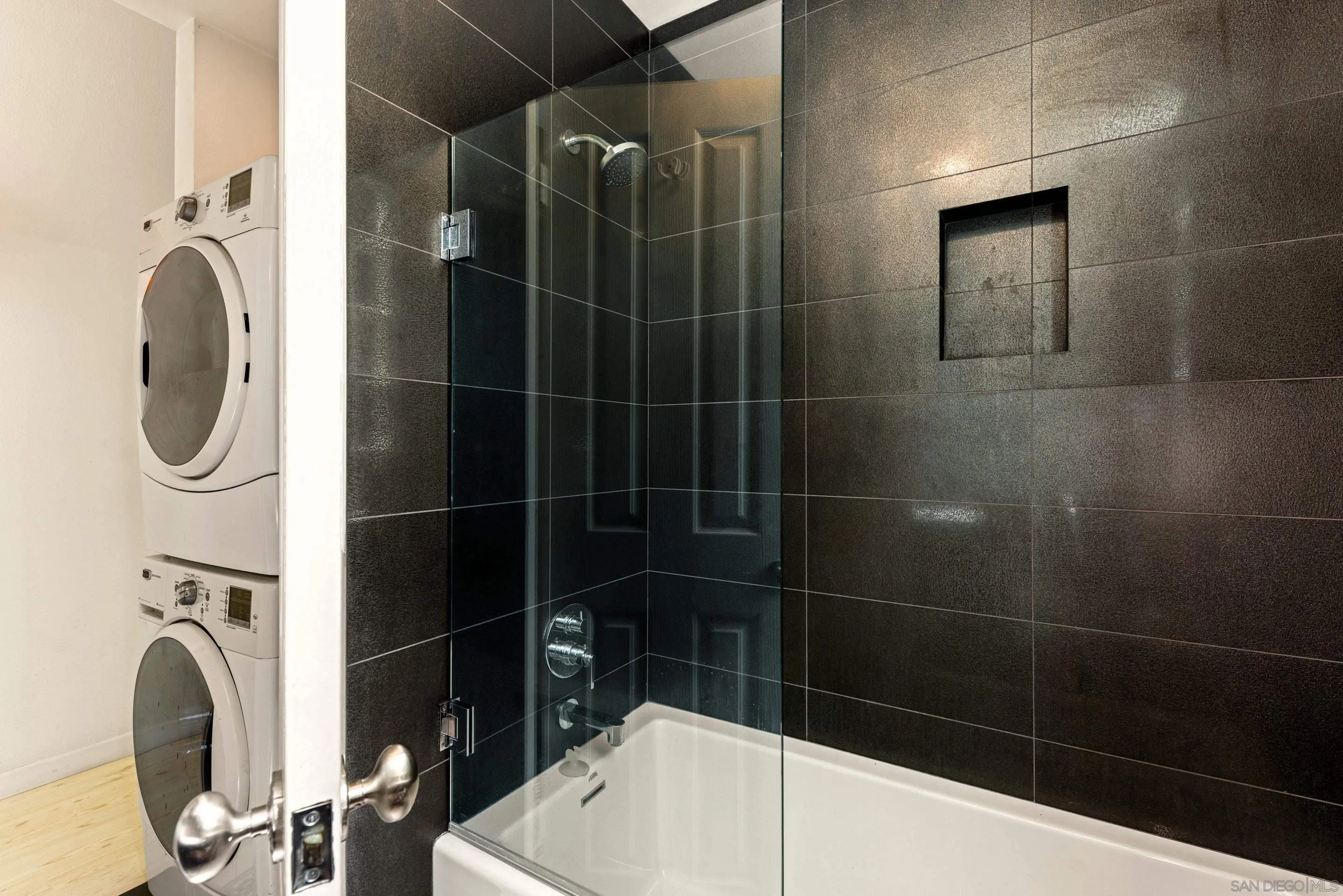 remodeled bath-with-soaking-tub-floor-to-ceiling-tile-194 Neptune Ave-Encinitas-CA-92024-Leucadia-neighborhood-featuring high ceilings, natural light, and coastal design in this oceanfront home listed by FW Property Group